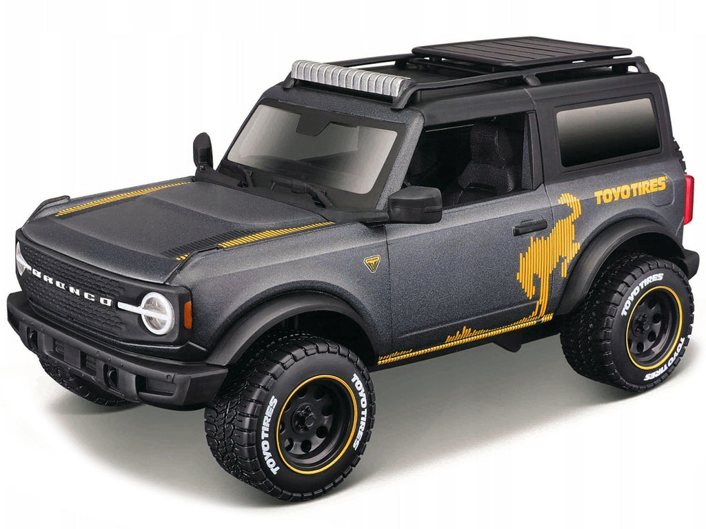 2021 Ford Bronco Badlands Dark Gray Metallic with Gold Graphics and Roof Rack "Off-Road" "Maisto Design" Series 1/24 Diecast Model Car by Maisto - image 2
