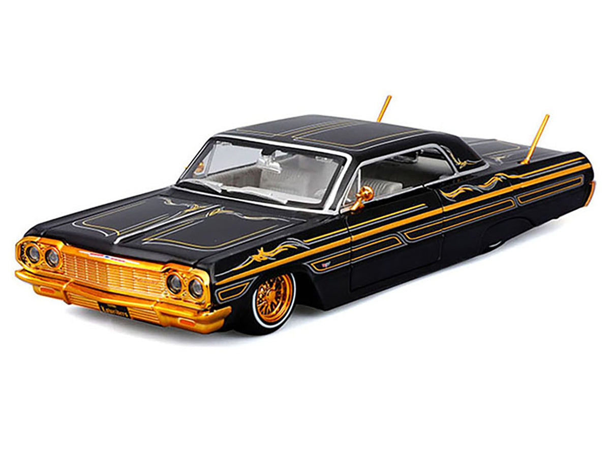 1964 Chevrolet Impala SS Lowrider Black Metallic with Gold Graphics and Gray Interior "Lowriders" "Maisto Design" Series 1/26 Diecast Model Car by Maisto - image 4
