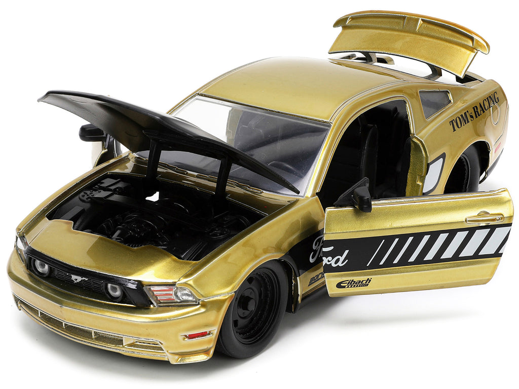 2010 Ford Mustang GT Gold Metallic with Black Graphics and Hood "Tom's Racing" "Bigtime Muscle" Series 1/24 Diecast Model Car by Jada - image 2