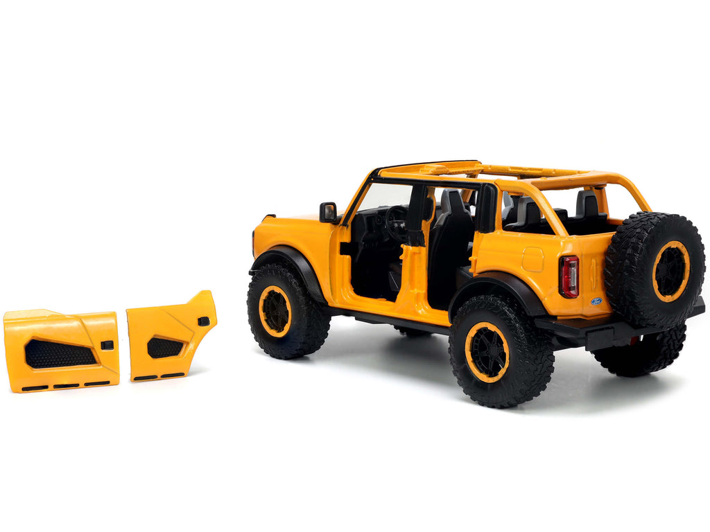 2021 Ford Bronco Orange Metallic with Extra Wheels "Just Trucks" Series 1/24 Diecast Model Car by Jada - image 3