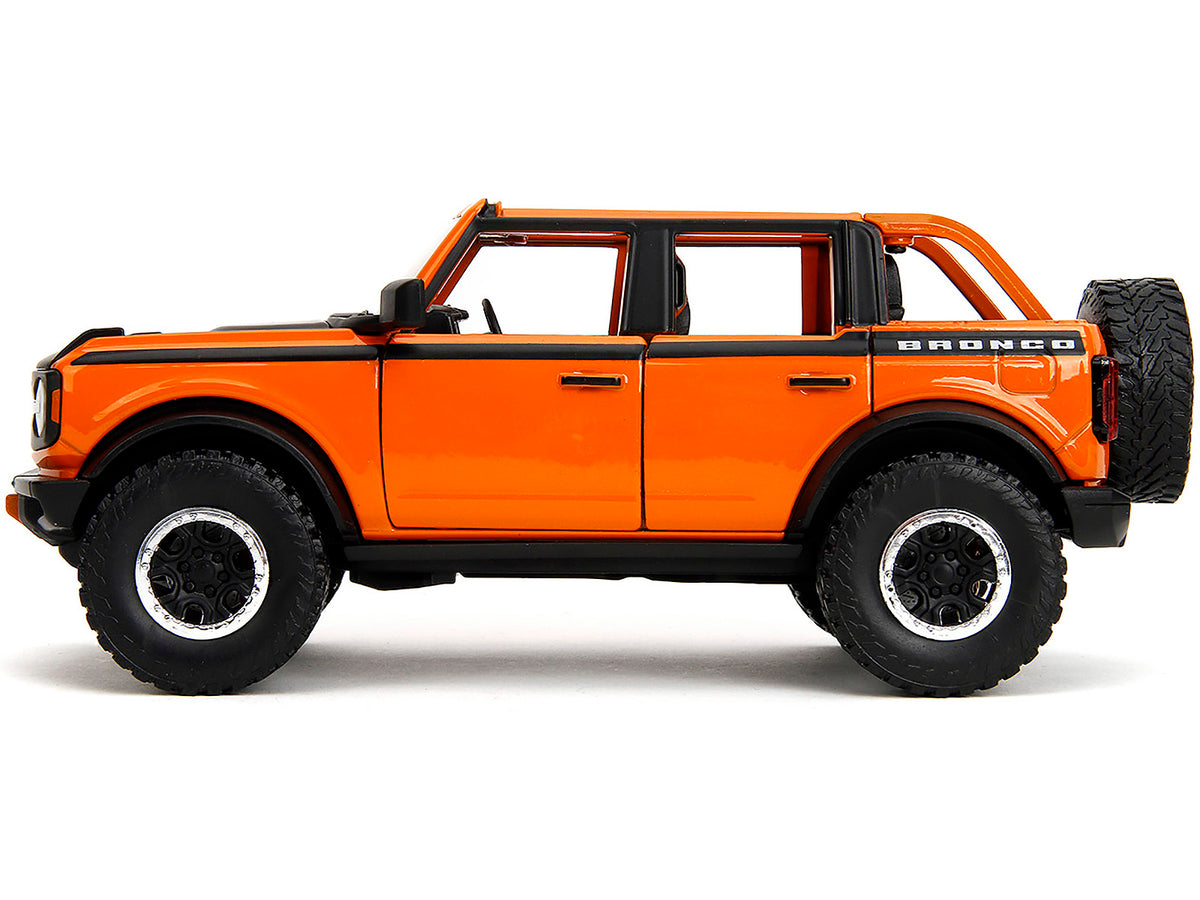 2021 Ford Bronco Open-Top Orange with Black Stripes and Hood with Extra Wheels "Just Trucks" Series 1/24 Diecast Model Car by Jada - image 3