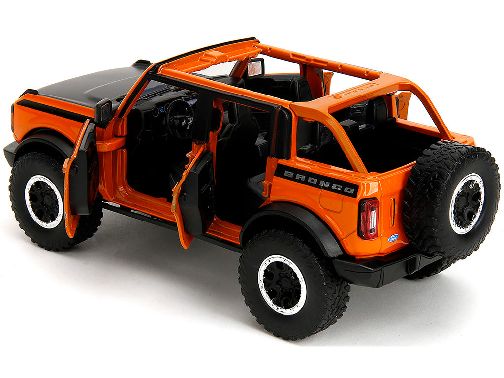 2021 Ford Bronco Open-Top Orange with Black Stripes and Hood with Extra Wheels "Just Trucks" Series 1/24 Diecast Model Car by Jada - image 4