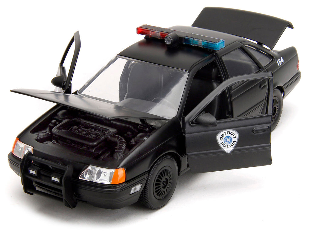 Ford Taurus OCP Matt Black "Detroit Police" and Robocop Diecast Figure 35th Anniversary "Robocop" (1987) Movie "Hollywood Rides" Series 1/24 Diecast Model Car by Jada - image 2