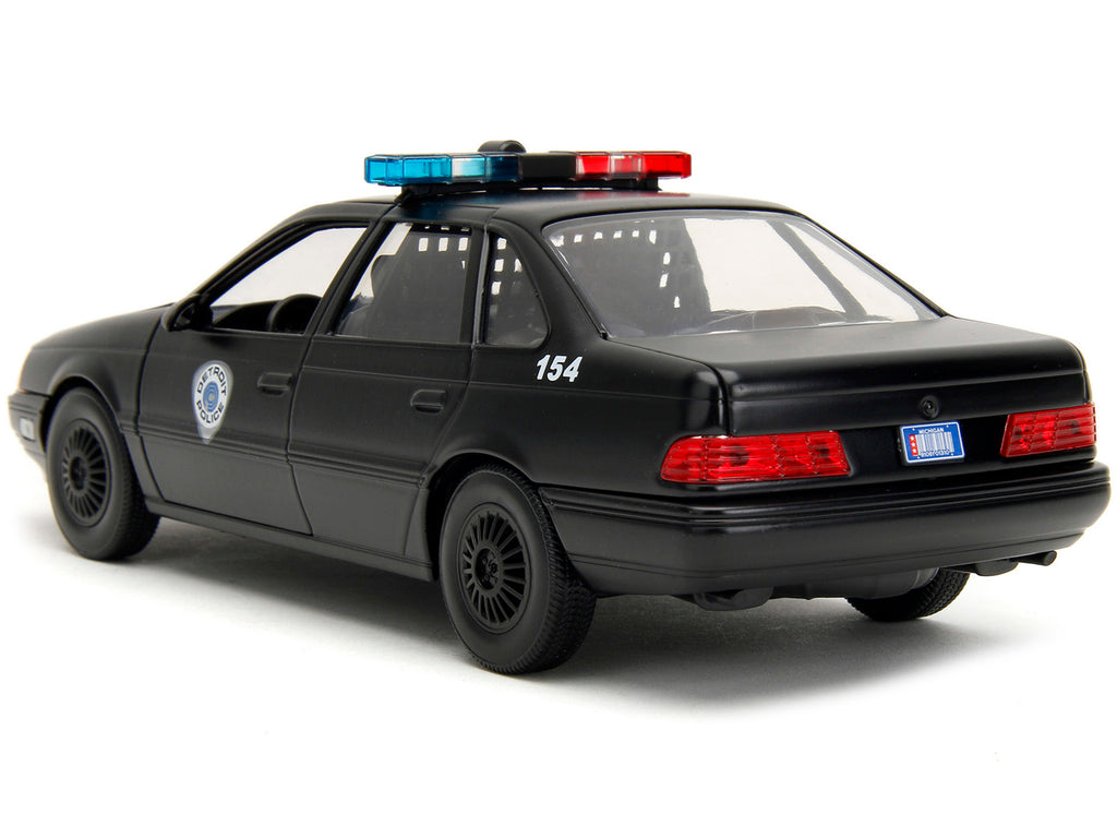 Ford Taurus OCP Matt Black "Detroit Police" and Robocop Diecast Figure 35th Anniversary "Robocop" (1987) Movie "Hollywood Rides" Series 1/24 Diecast Model Car by Jada - image 4